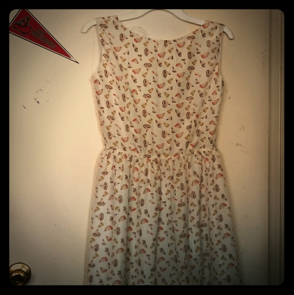Chong Er Cream dress with pencil shaving design